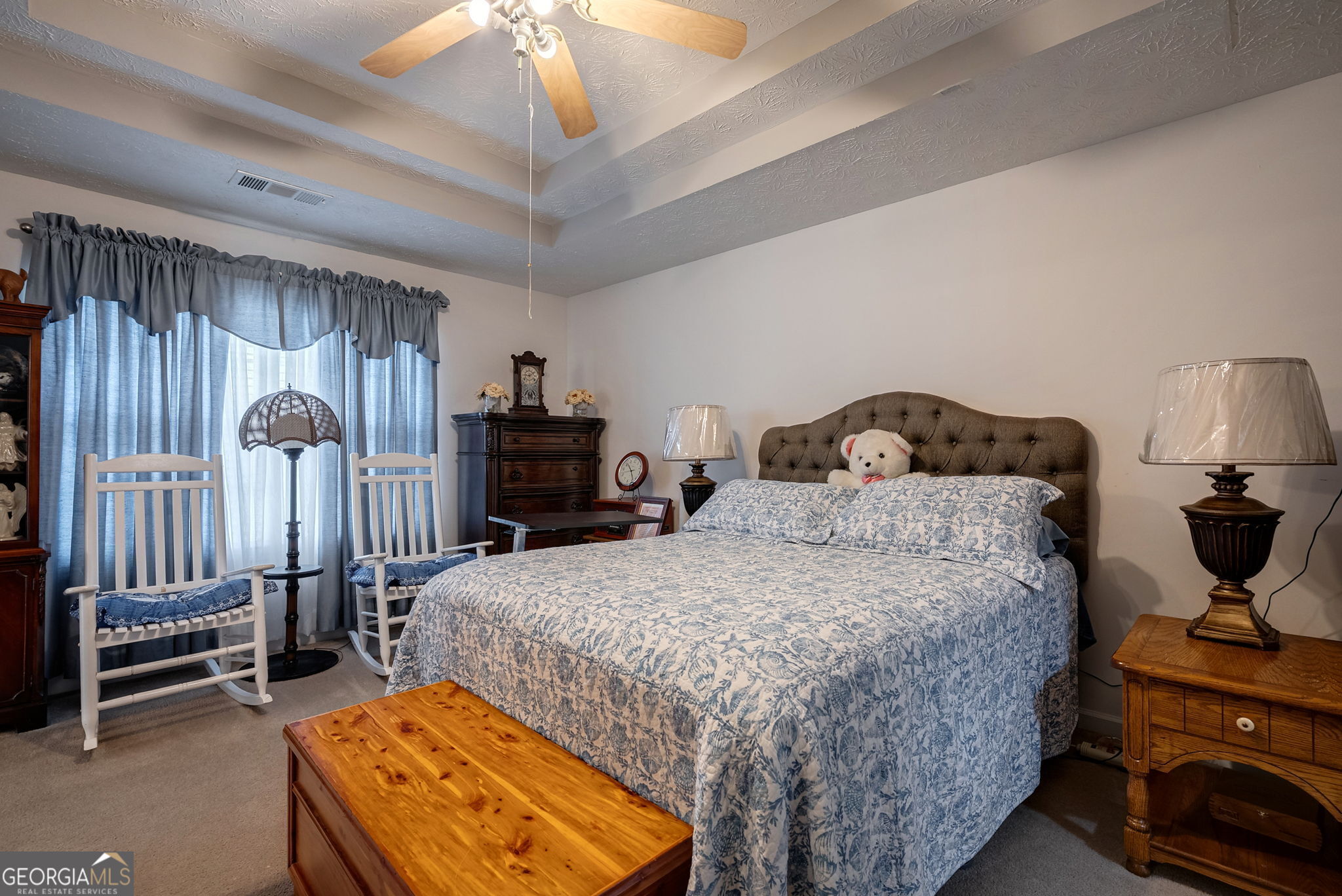 1415 Blanding Way Winder, GA 30680 - Photo 6 of 39 a bedroom with a bed and a chandelier