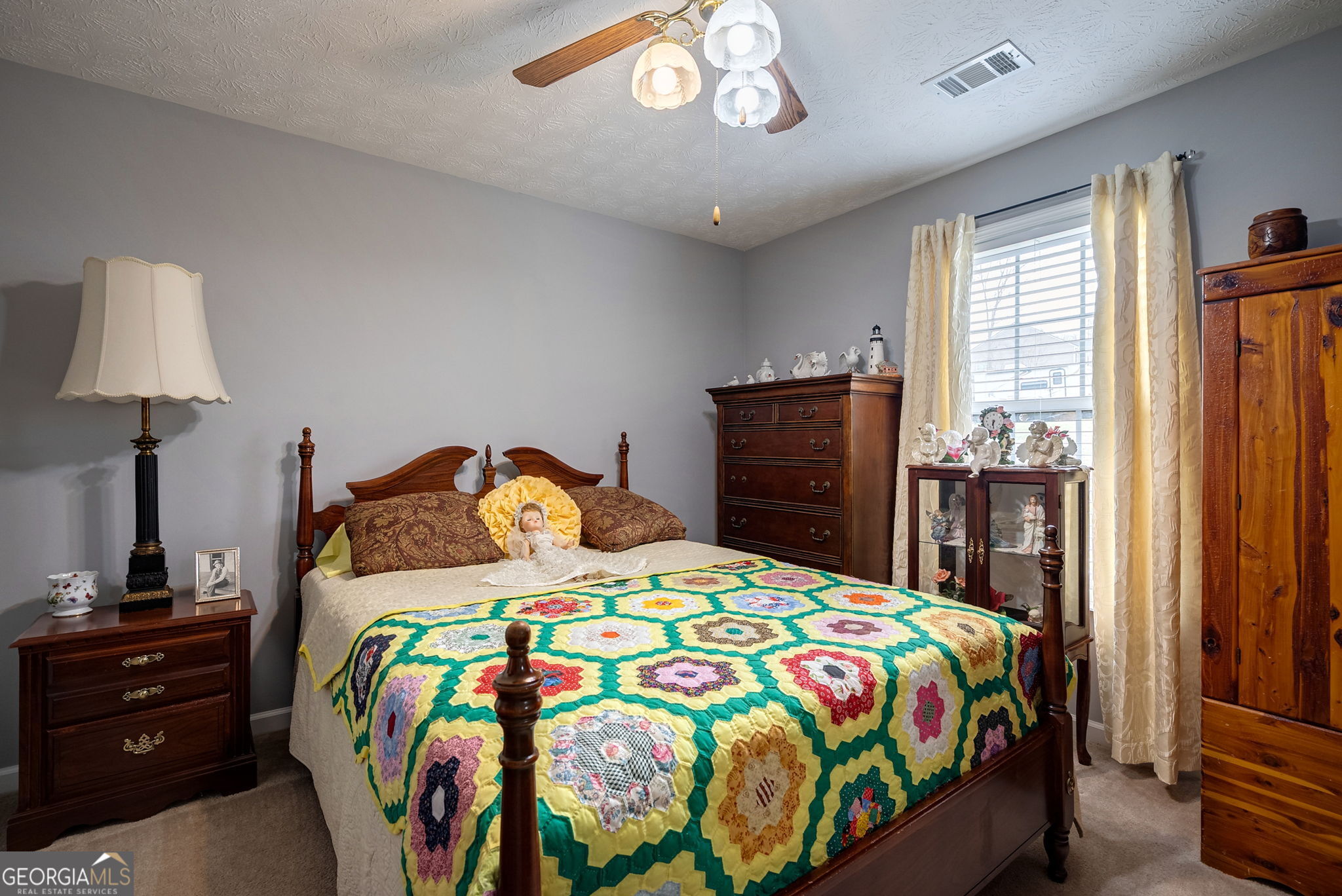 1415 Blanding Way Winder, GA 30680 - Photo 8 of 39 a bedroom with a bed and a lamp on the dresser