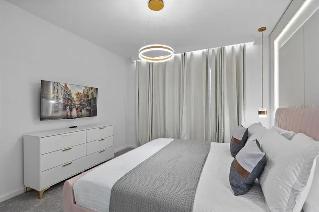 a bathroom with a granite countertop sink a toilet and a mirror