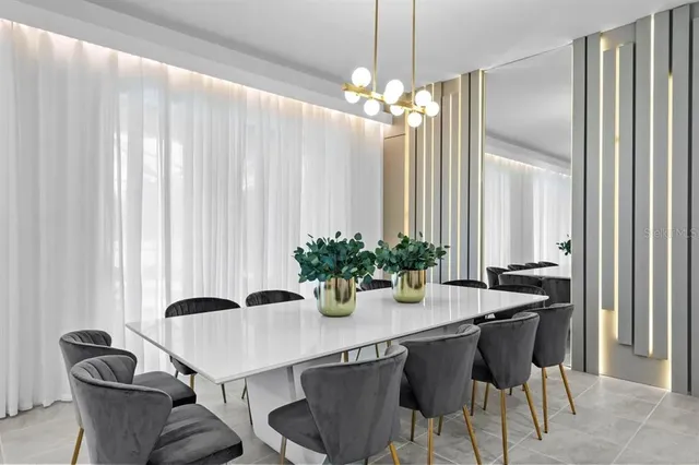 a dining room with furniture and window