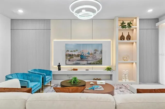 a living room with furniture and a painting