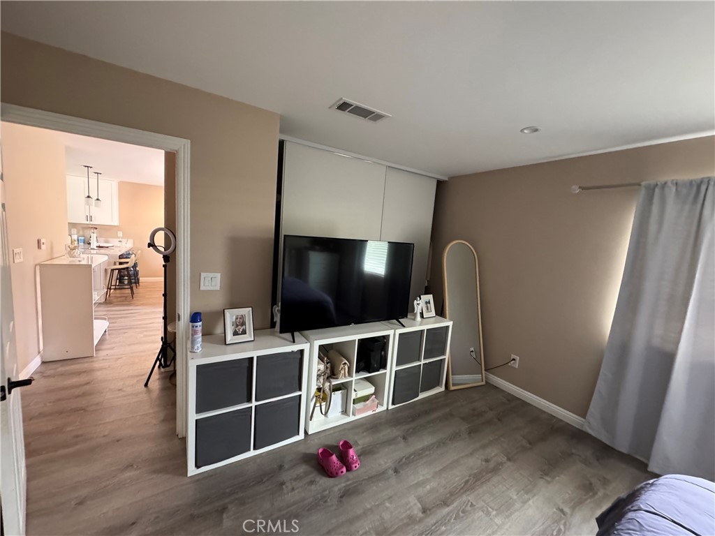 15057 Paddock Street Sylmar, CA 91342 - Photo 11 of 19 a view of a livingroom with furniture and a flat screen tv