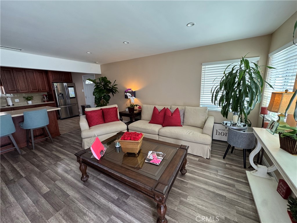 15057 Paddock Street Sylmar, CA 91342 - Photo 12 of 19 a living room with furniture and a flat screen tv