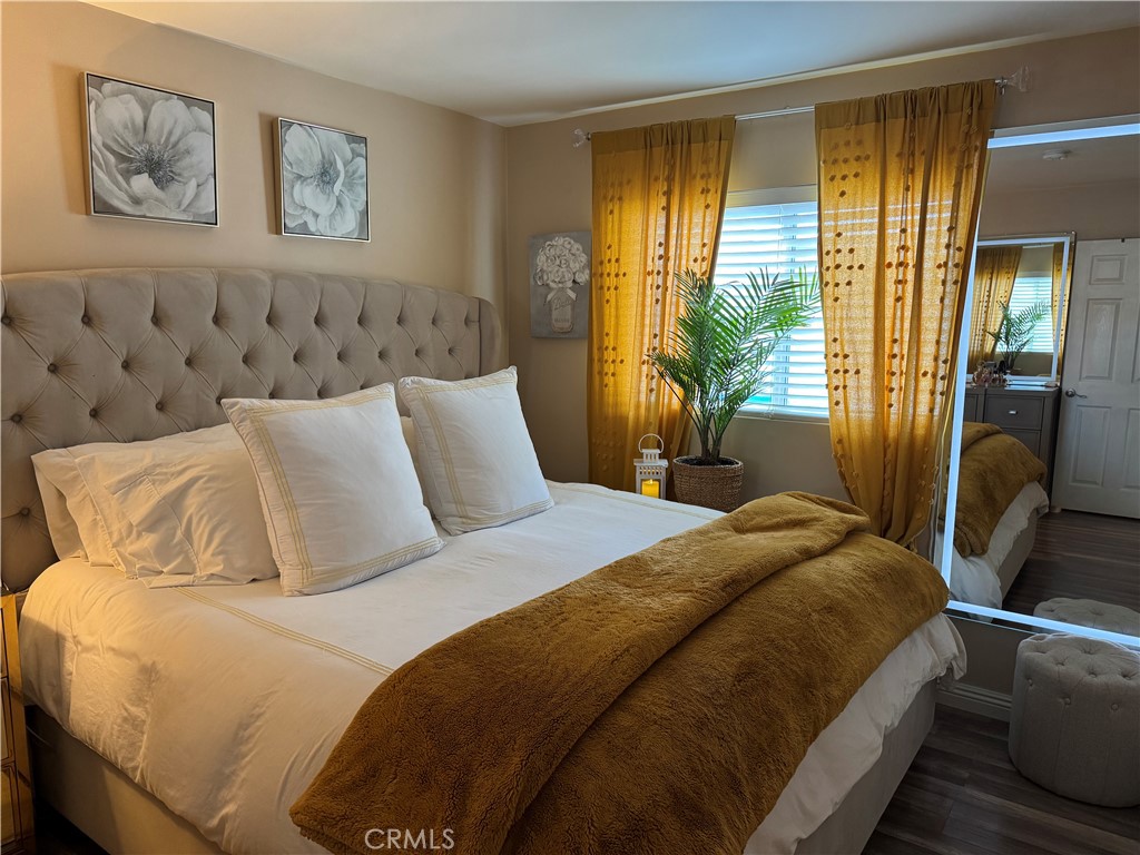 15057 Paddock Street Sylmar, CA 91342 - Photo 19 of 19 a bedroom with a large bed and a window