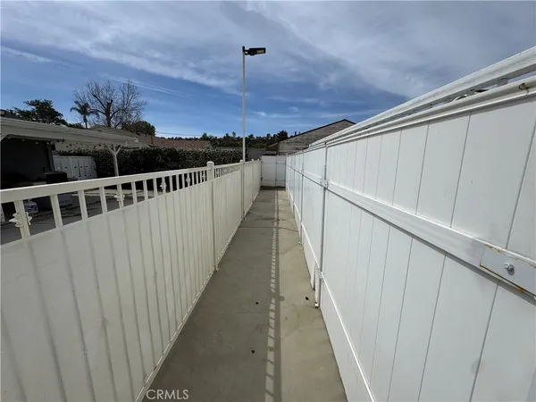 a view of roof deck with two chairs and a table