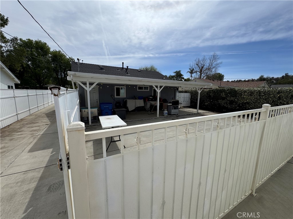 15057 Paddock Street Sylmar, CA 91342 - Photo 6 of 19 a view of roof deck with two chairs and a table