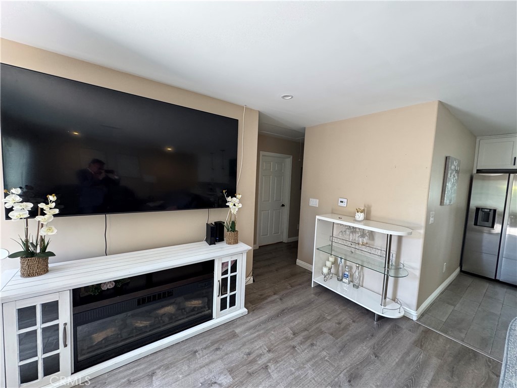 15057 Paddock Street Sylmar, CA 91342 - Photo 8 of 19 a living room with furniture and a flat screen tv