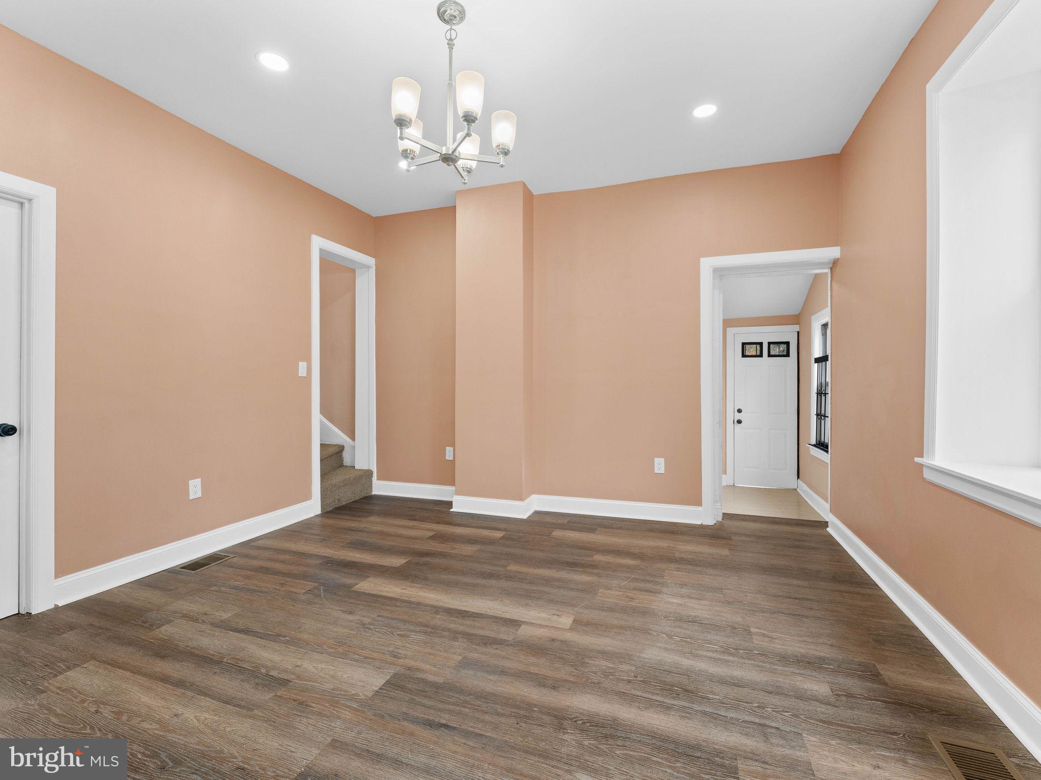 413 High Street Philadelphia, PA 19144 - Photo 16 of 37 a view of an empty room with wooden floor