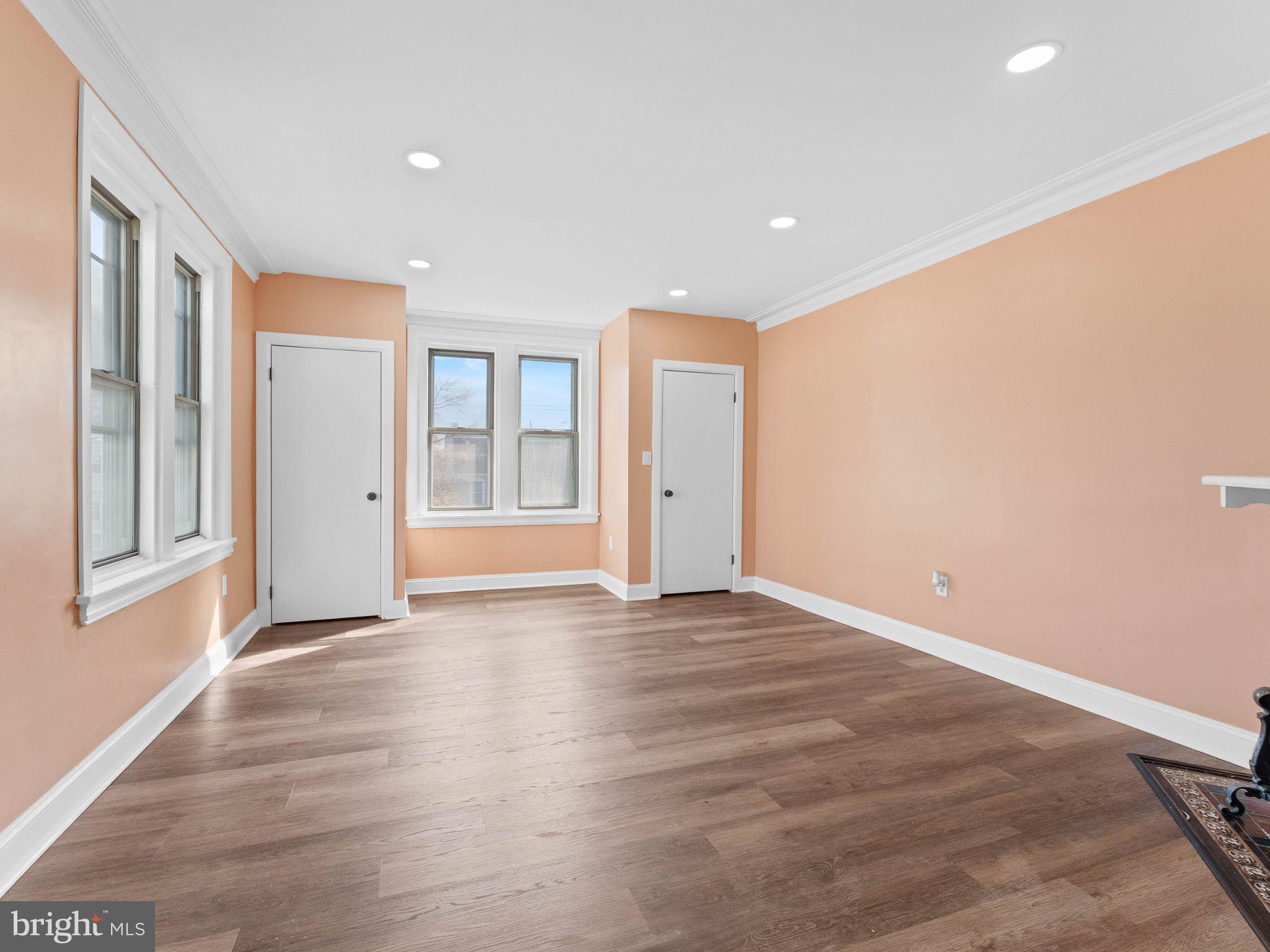 413 High Street Philadelphia, PA 19144 - Photo 20 of 37 a view of an empty room with window and wooden floor