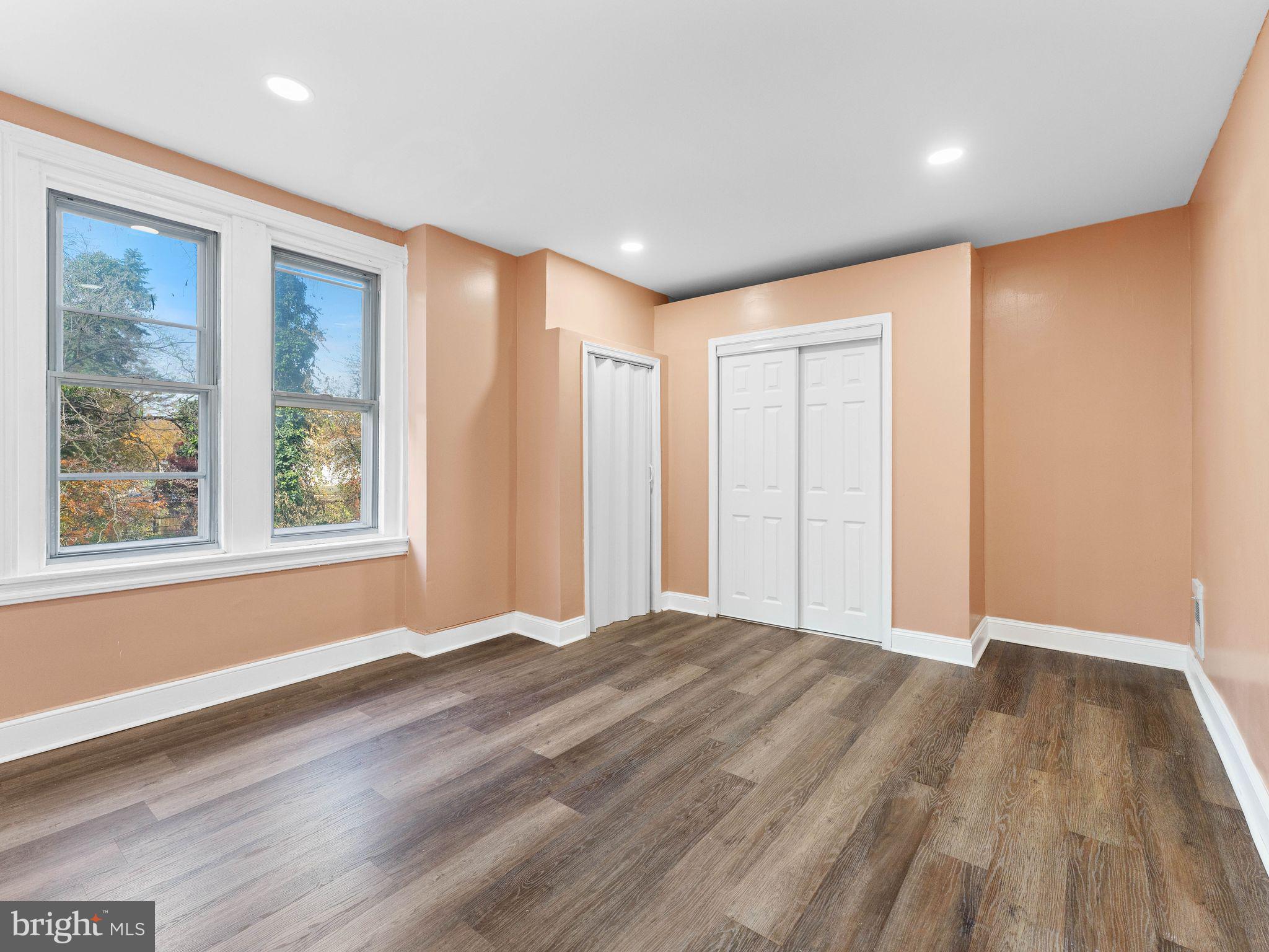 413 High Street Philadelphia, PA 19144 - Photo 23 of 37 a view of an empty room with wooden floor and a window
