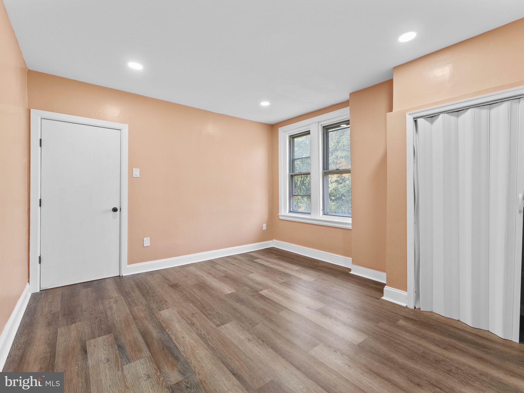 413 High Street Philadelphia, PA 19144 - Photo 24 of 37 a view of an empty room with wooden floor and a window