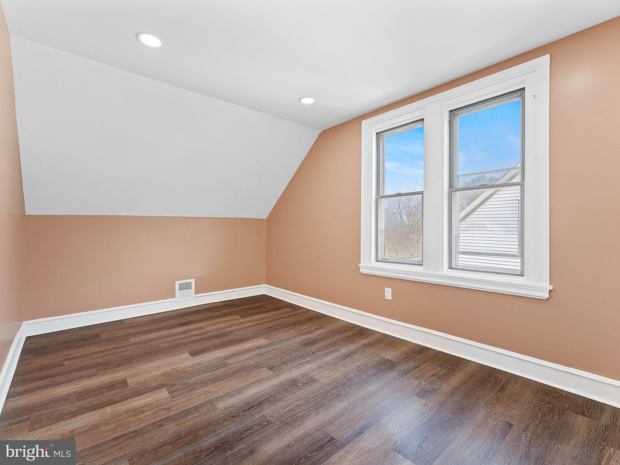 413 High Street Philadelphia, PA 19144 - Photo 27 of 37 a view of empty room with wooden floor and fan