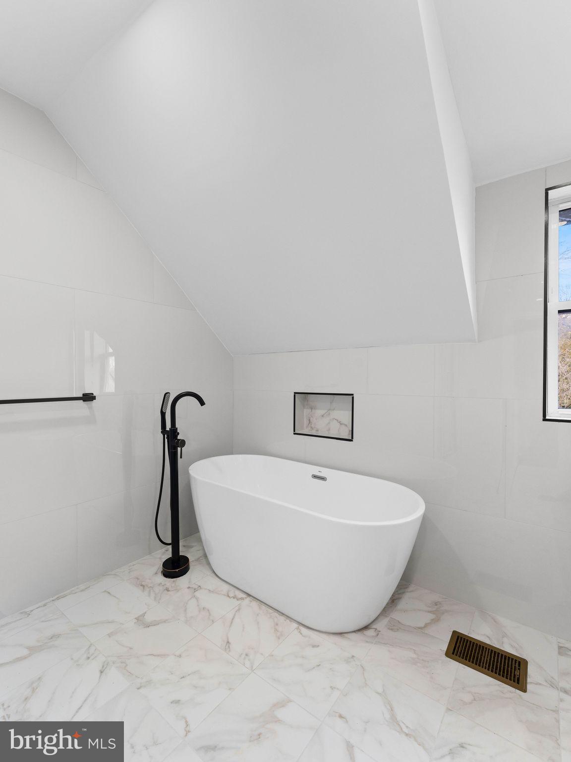 413 High Street Philadelphia, PA 19144 - Photo 32 of 37 a white bath tub sitting in a bathroom