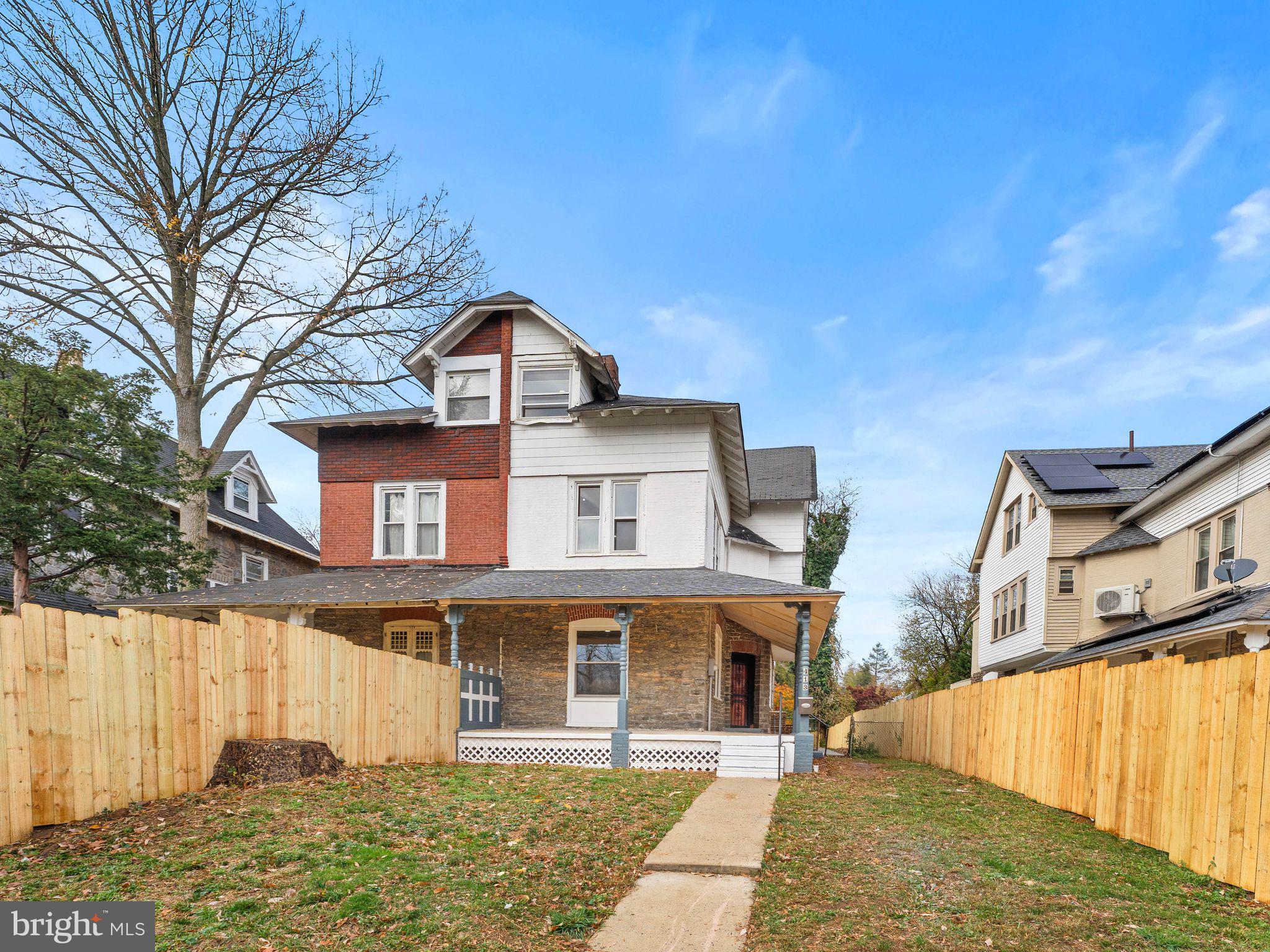 413 High Street Philadelphia, PA 19144 - Photo 35 of 37 a front view of a house with a yard