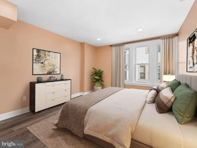 a view of a brick house with large windows