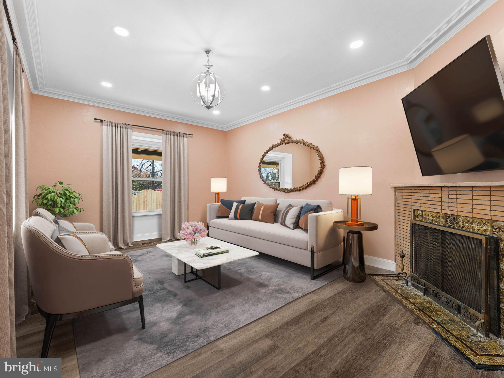 413 High Street Philadelphia, PA 19144 - Photo 9 of 37 a living room with furniture a fireplace and a flat screen tv