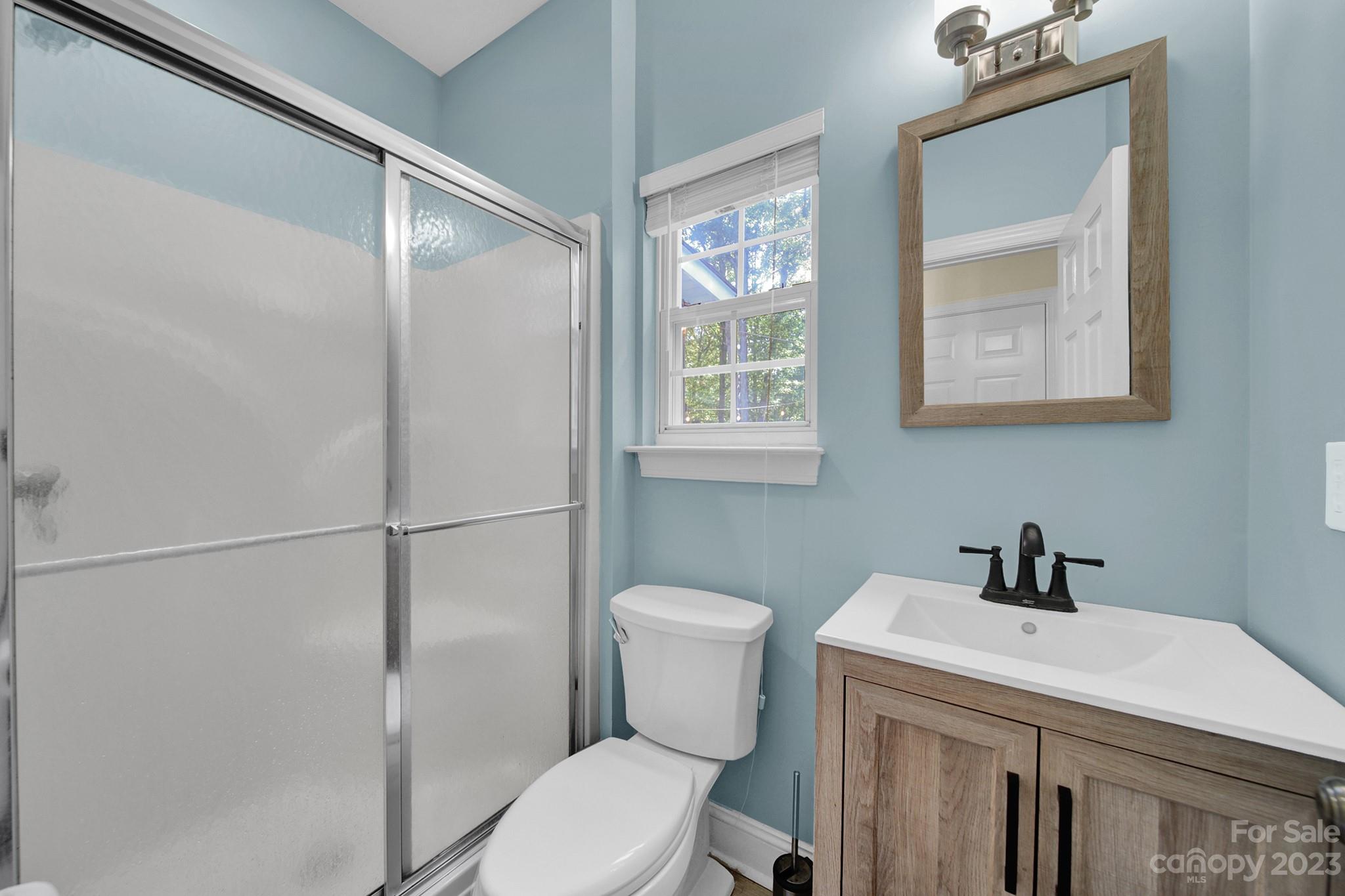 16014 Virginia Lee Court Fort Mill, SC 29708 - Photo 19 of 47 a bathroom with a sink a toilet and shower
