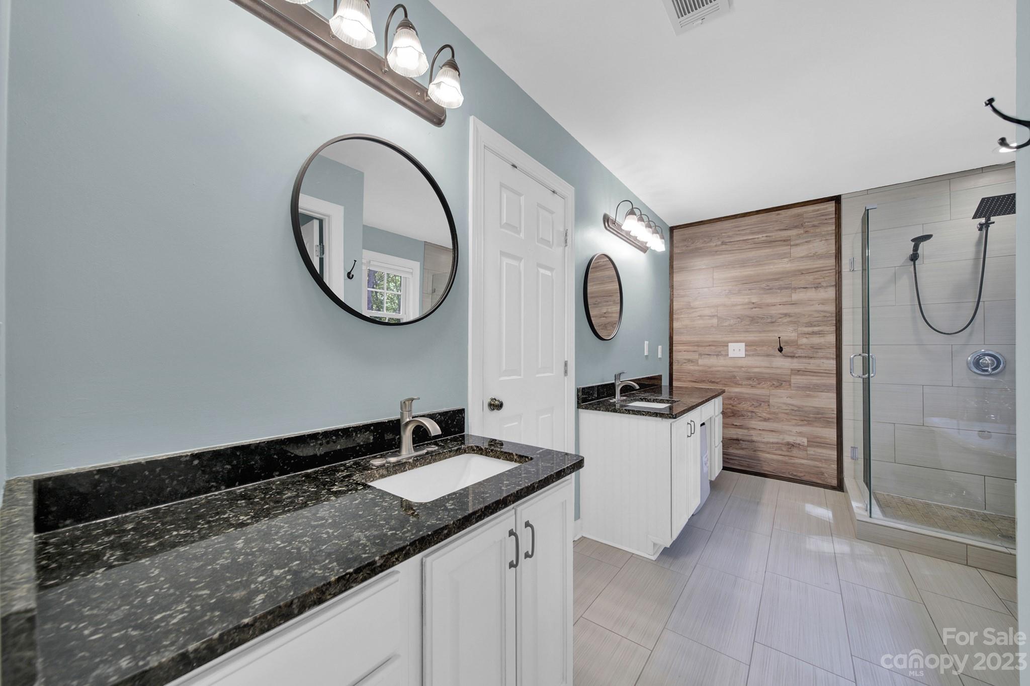 16014 Virginia Lee Court Fort Mill, SC 29708 - Photo 24 of 47 a bathroom with a granite countertop sink and a mirror