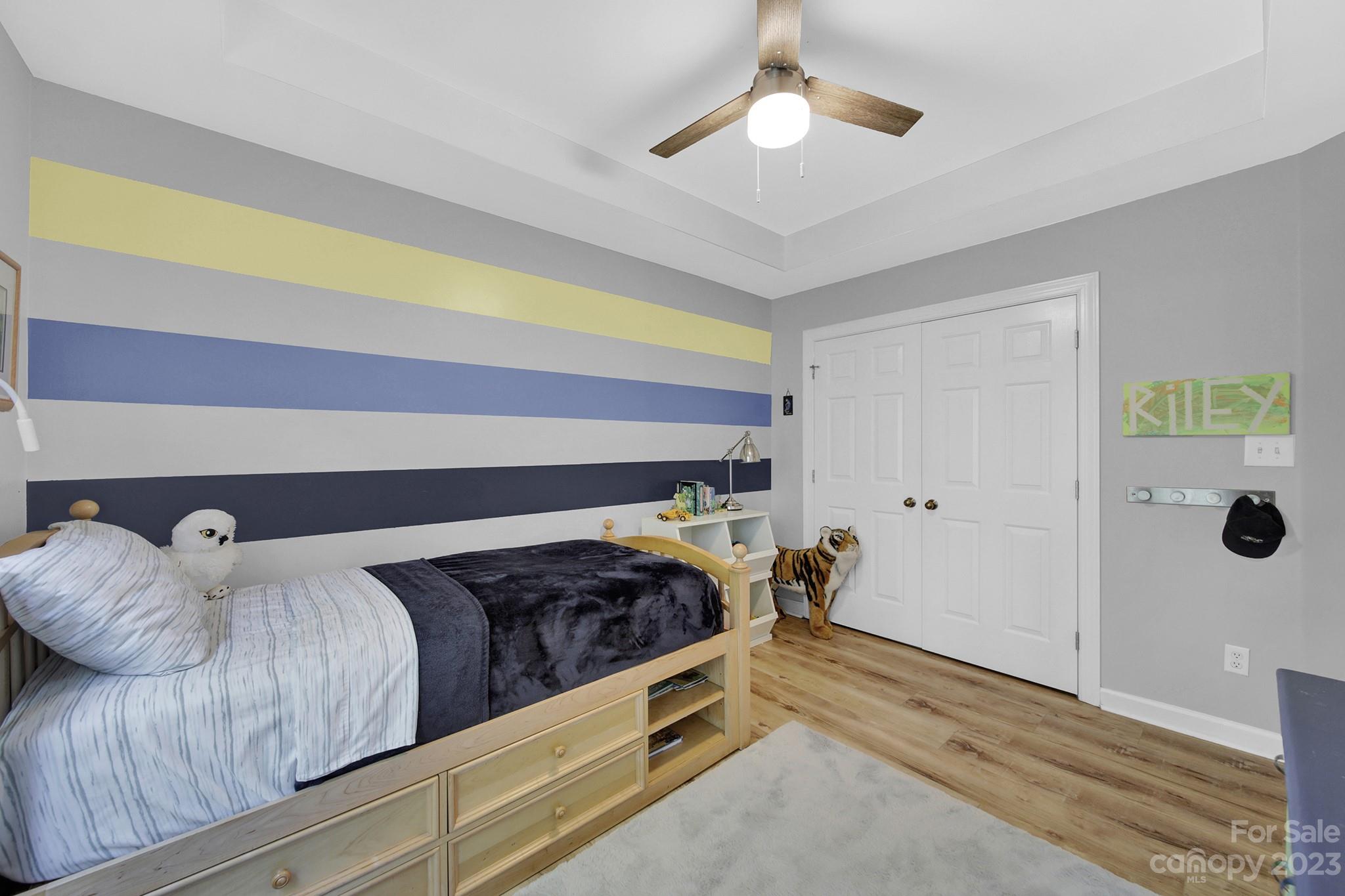 16014 Virginia Lee Court Fort Mill, SC 29708 - Photo 30 of 47 a bedroom with a bed and a chandelier