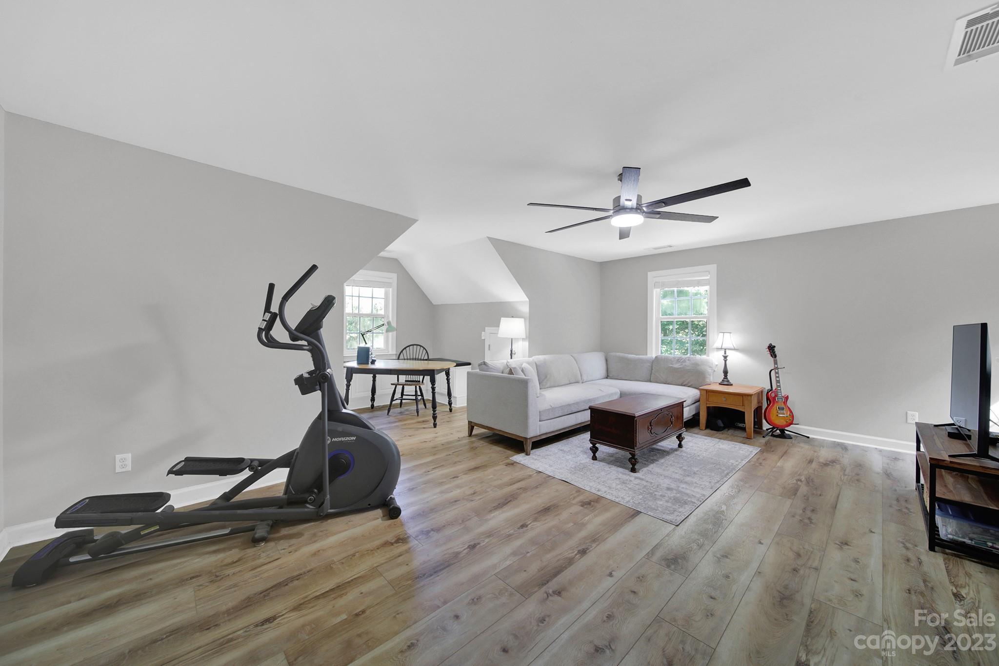 16014 Virginia Lee Court Fort Mill, SC 29708 - Photo 32 of 47 a living room with furniture and a chandelier