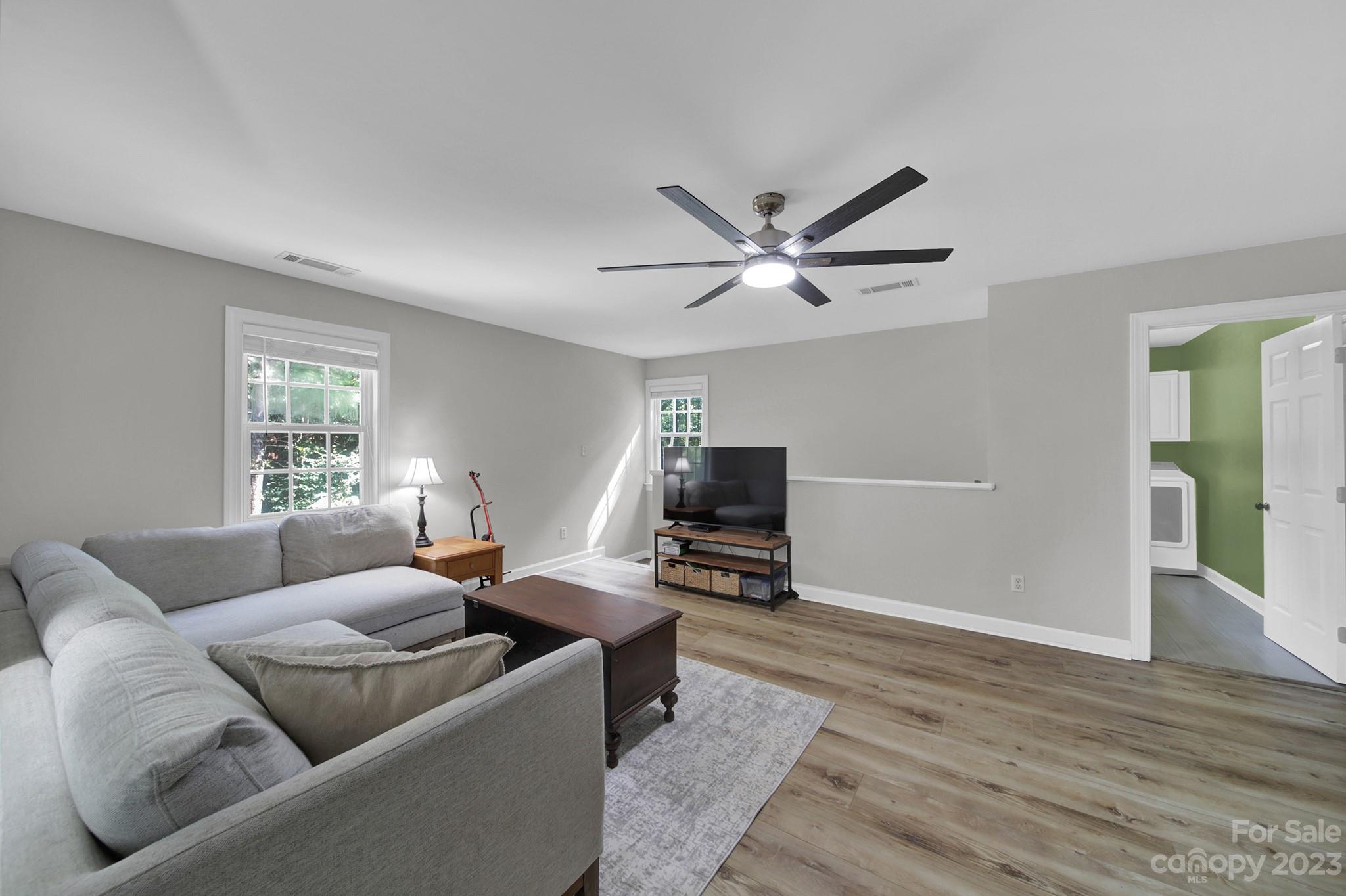 16014 Virginia Lee Court Fort Mill, SC 29708 - Photo 33 of 47 a living room with furniture a ceiling fan and a window