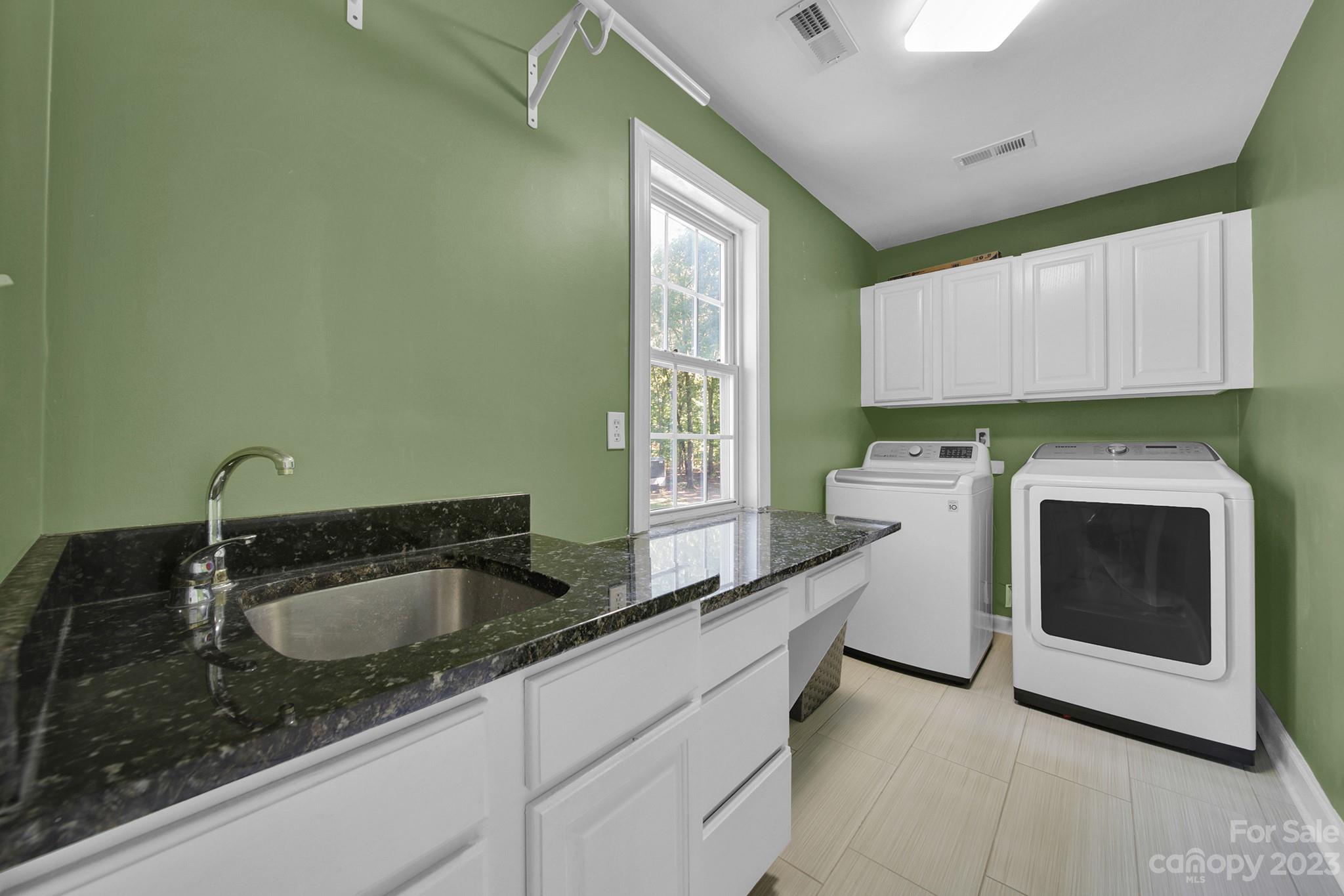 16014 Virginia Lee Court Fort Mill, SC 29708 - Photo 35 of 47 a kitchen with sink a stove and cabinets