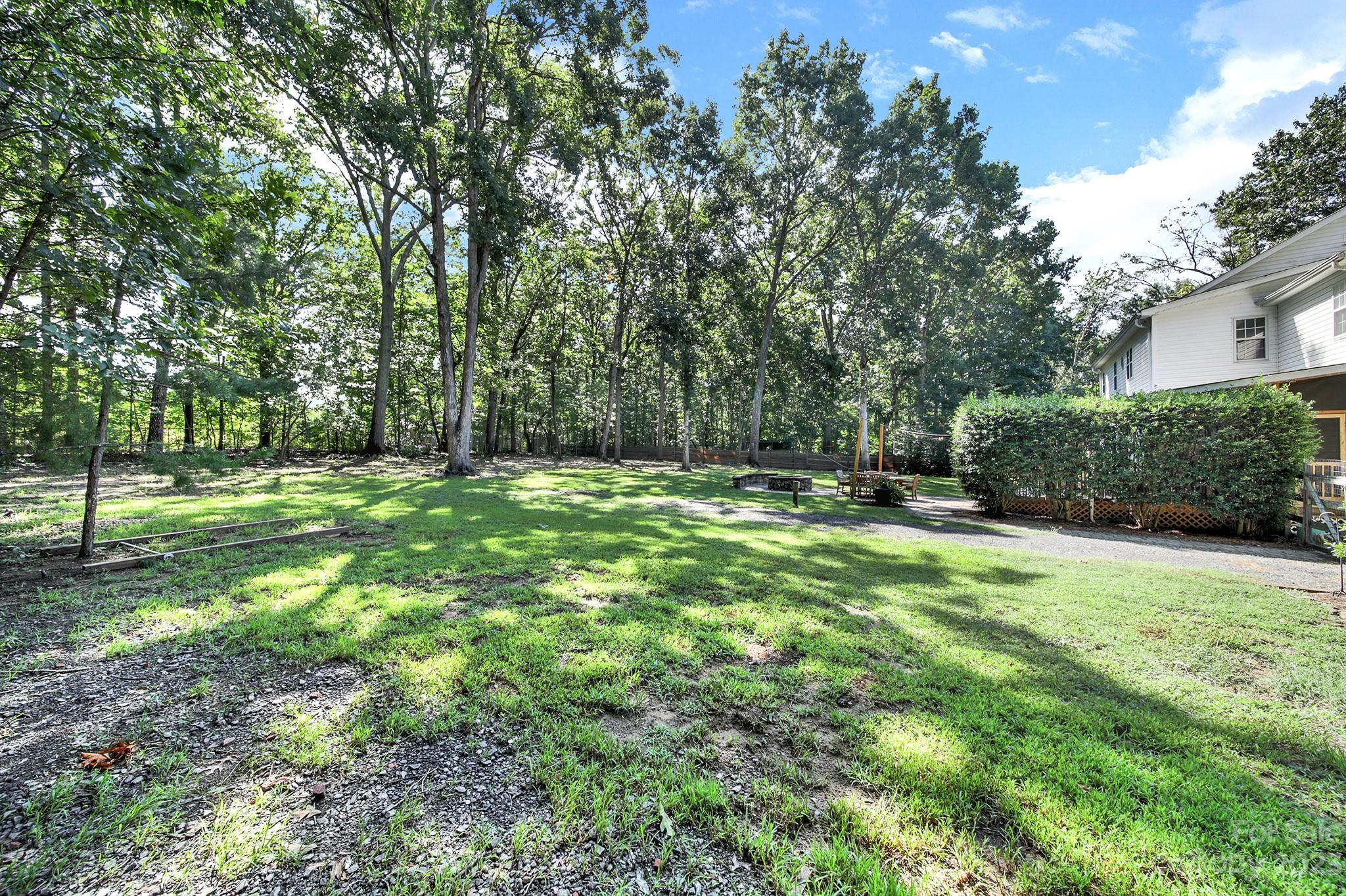 16014 Virginia Lee Court Fort Mill, SC 29708 - Photo 41 of 47 a backyard of a house with lots of green space