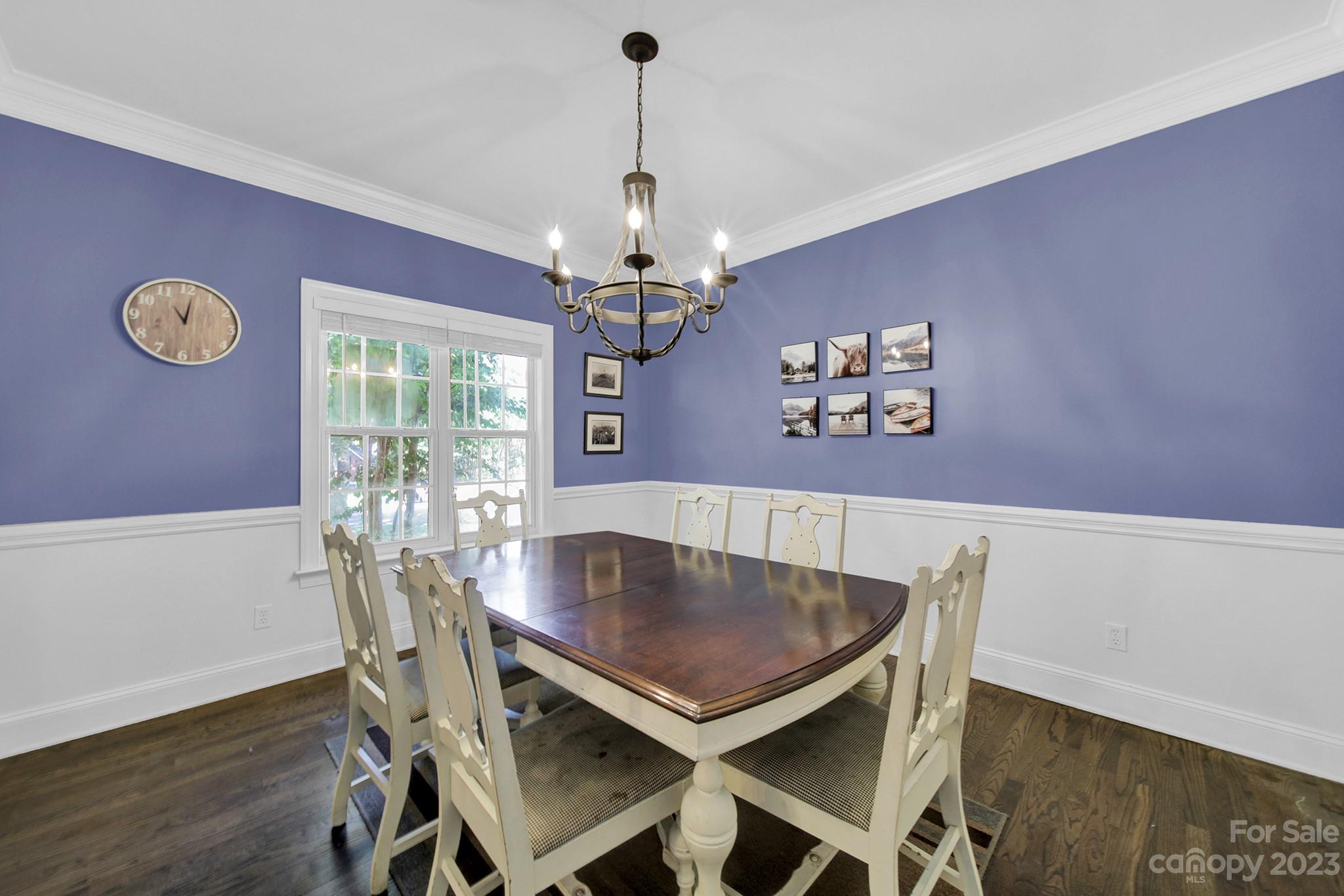 16014 Virginia Lee Court Fort Mill, SC 29708 - Photo 10 of 47 a view of a dining room with furniture a chandelier and wooden floor