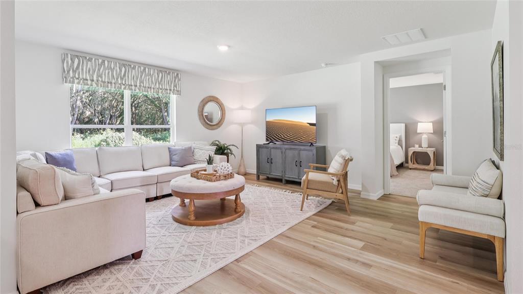 4705 Southwest 89th Street Ocala, FL 34476 - Photo 9 of 22 a living room with furniture and a large window