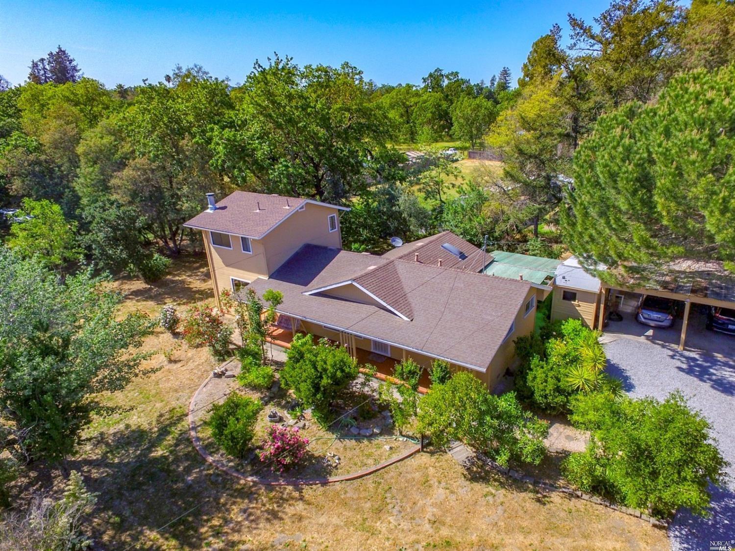 3617 Guerneville Road Santa Rosa, CA 95401 - Photo 1 of 1 an aerial view of a house with garden space and street view