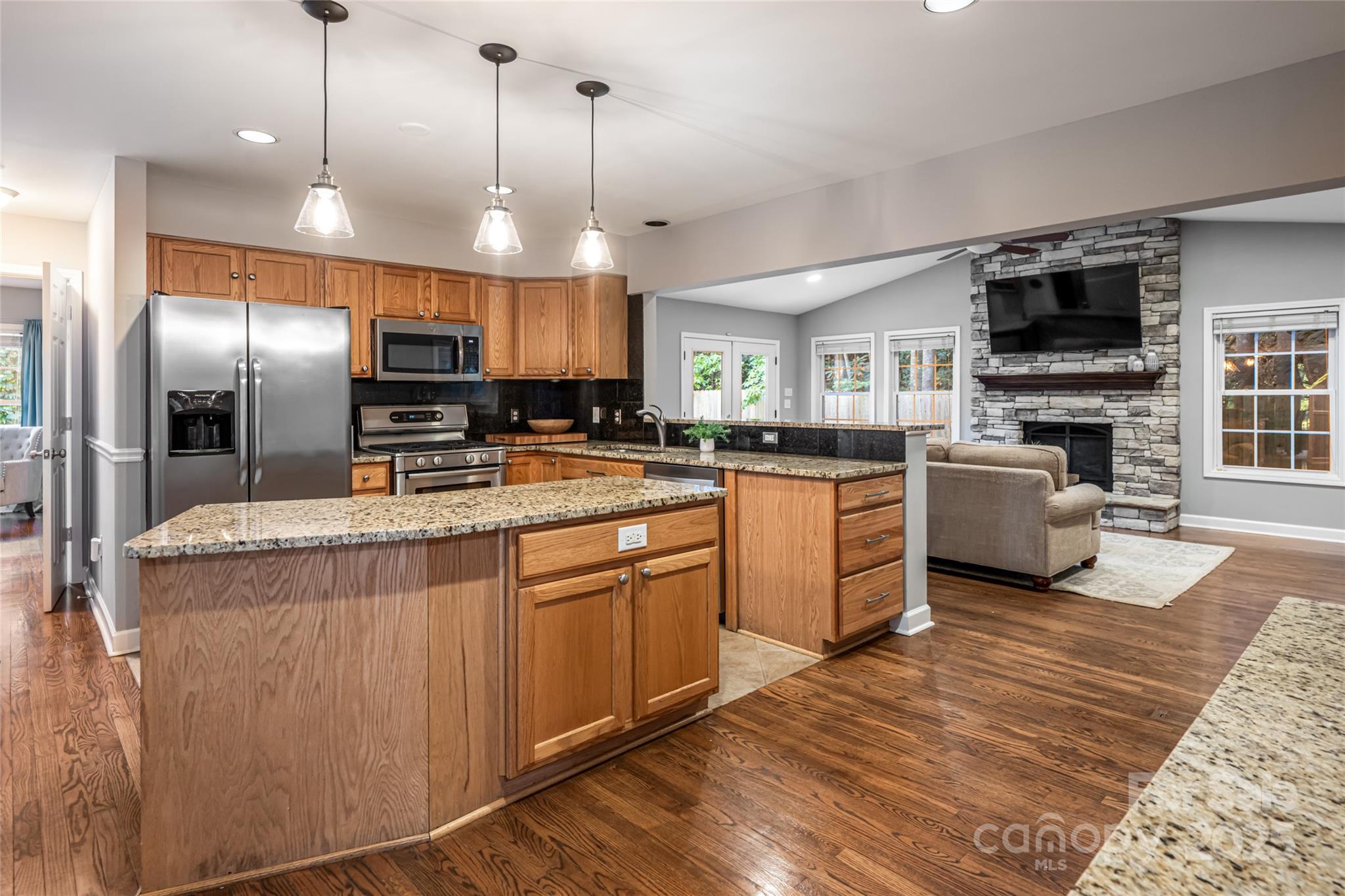 315 Glenn Bridge Road Arden, NC 28704 - Photo 18 of 45 a kitchen with stainless steel appliances granite countertop a sink a stove and a refrigerator