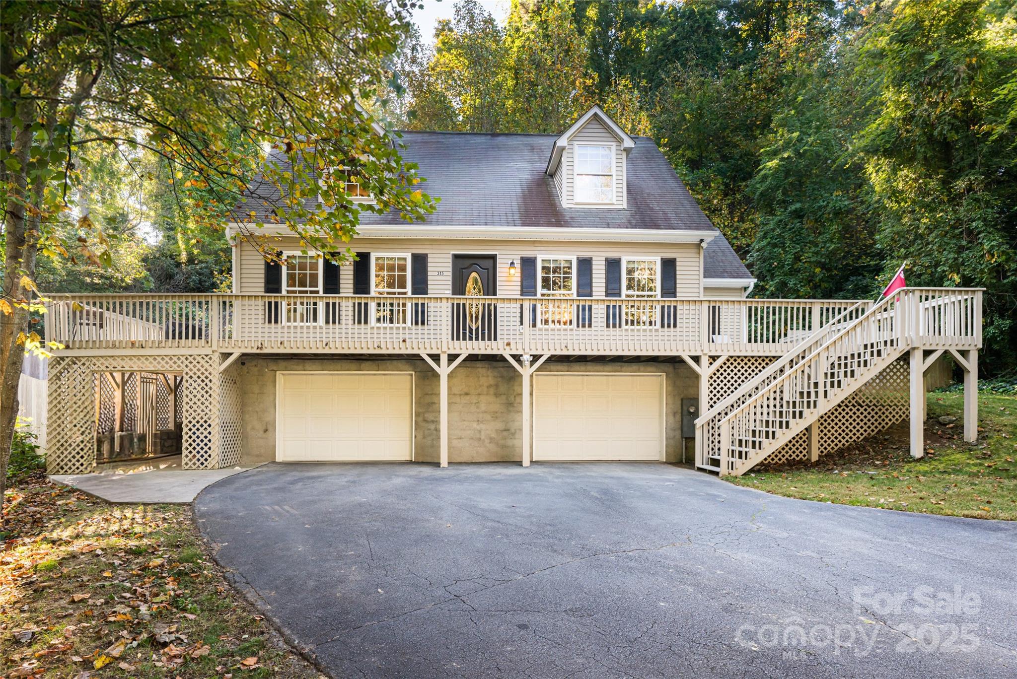 315 Glenn Bridge Road Arden, NC 28704 - Photo 2 of 45 a front view of a house with a yard and garage