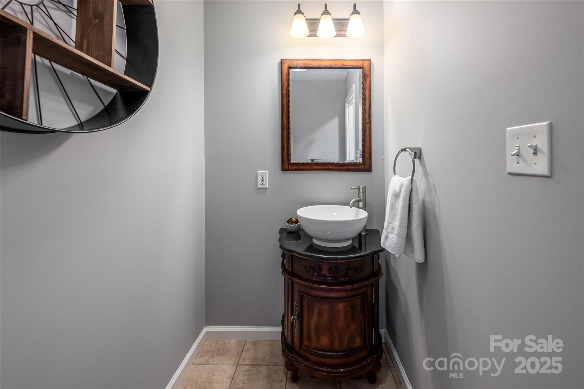 315 Glenn Bridge Road Arden, NC 28704 - Photo 23 of 45 a bathroom with a mirror a washer and dryer