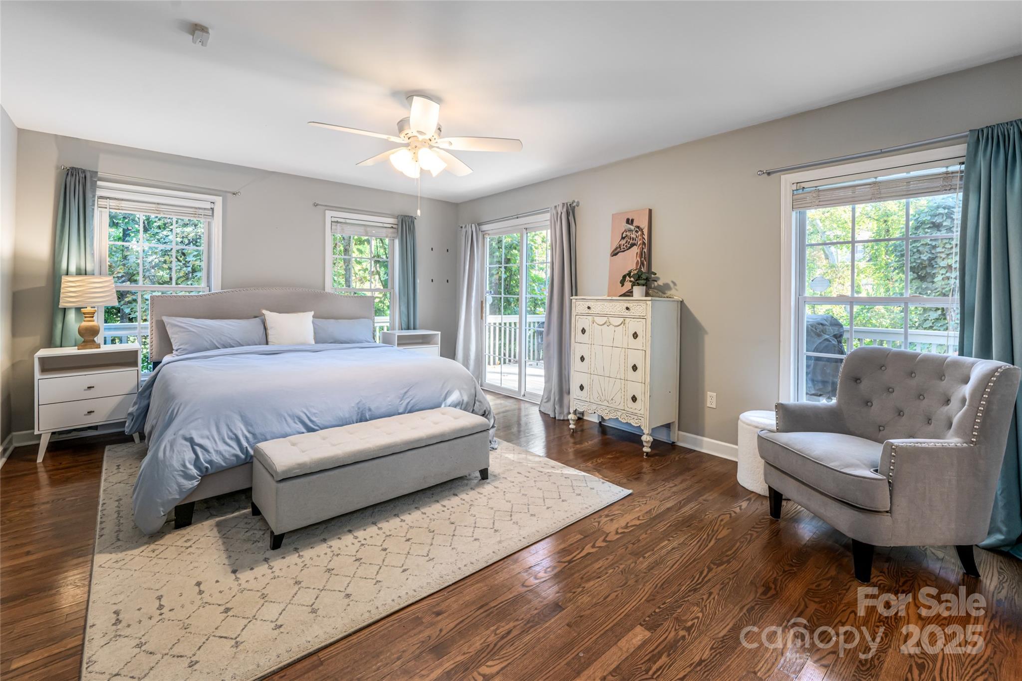 315 Glenn Bridge Road Arden, NC 28704 - Photo 25 of 45 a spacious bedroom with a bed and a couch