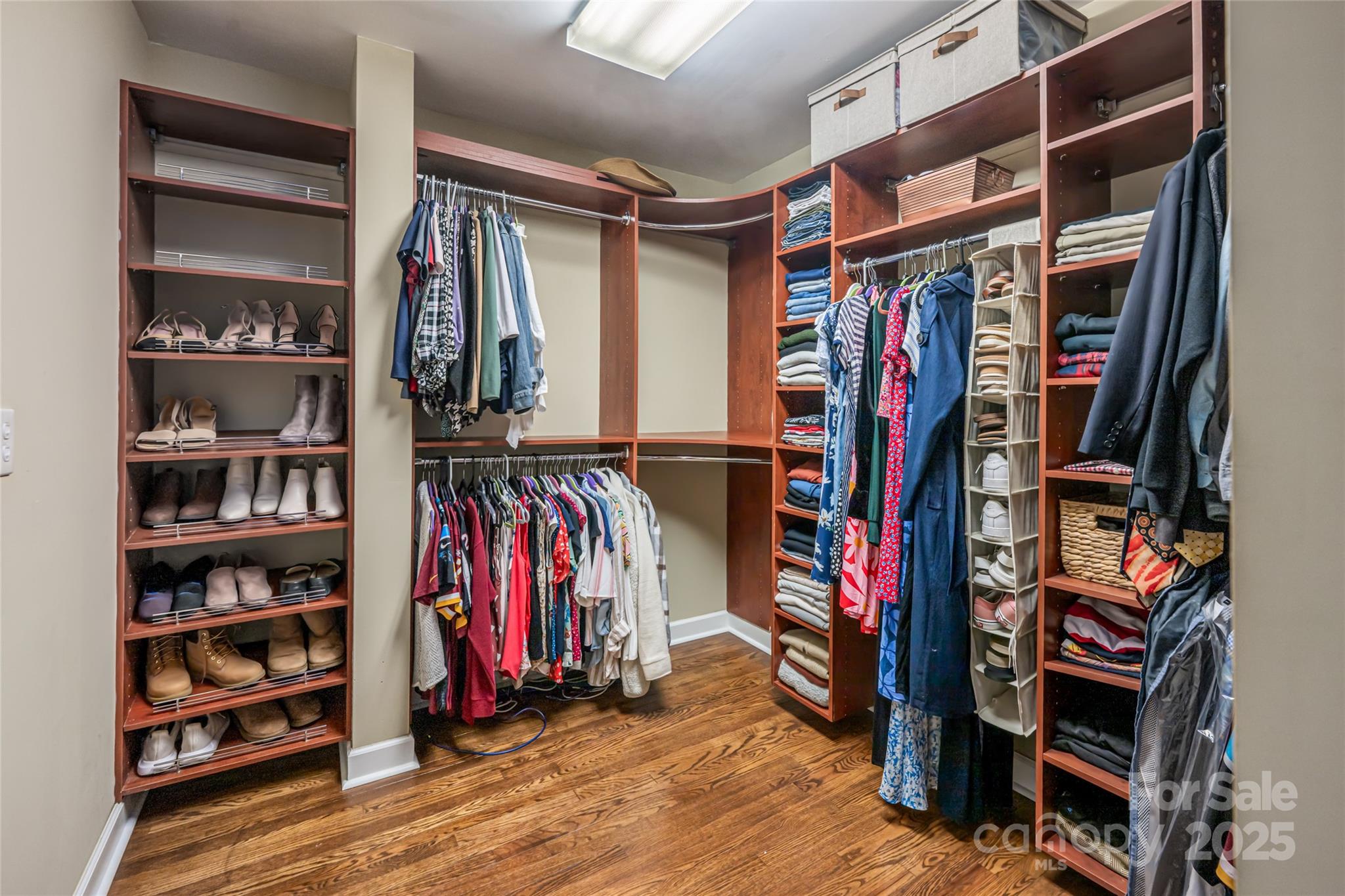 315 Glenn Bridge Road Arden, NC 28704 - Photo 27 of 45 a view of walk in closet with clothes and shoes