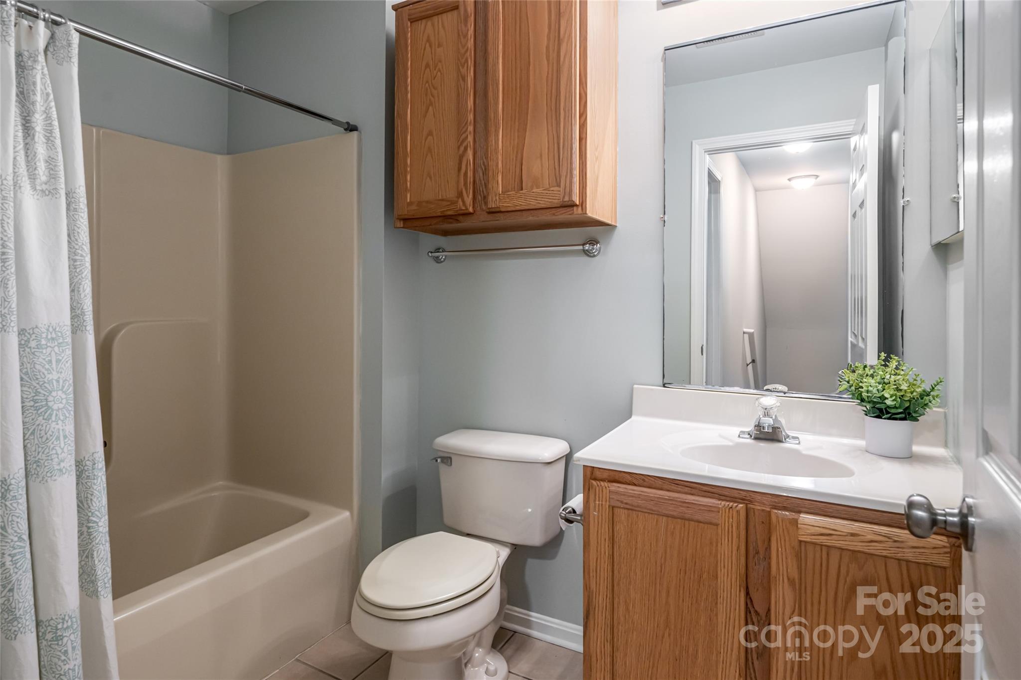 315 Glenn Bridge Road Arden, NC 28704 - Photo 34 of 45 a bathroom with a sink a toilet and shower