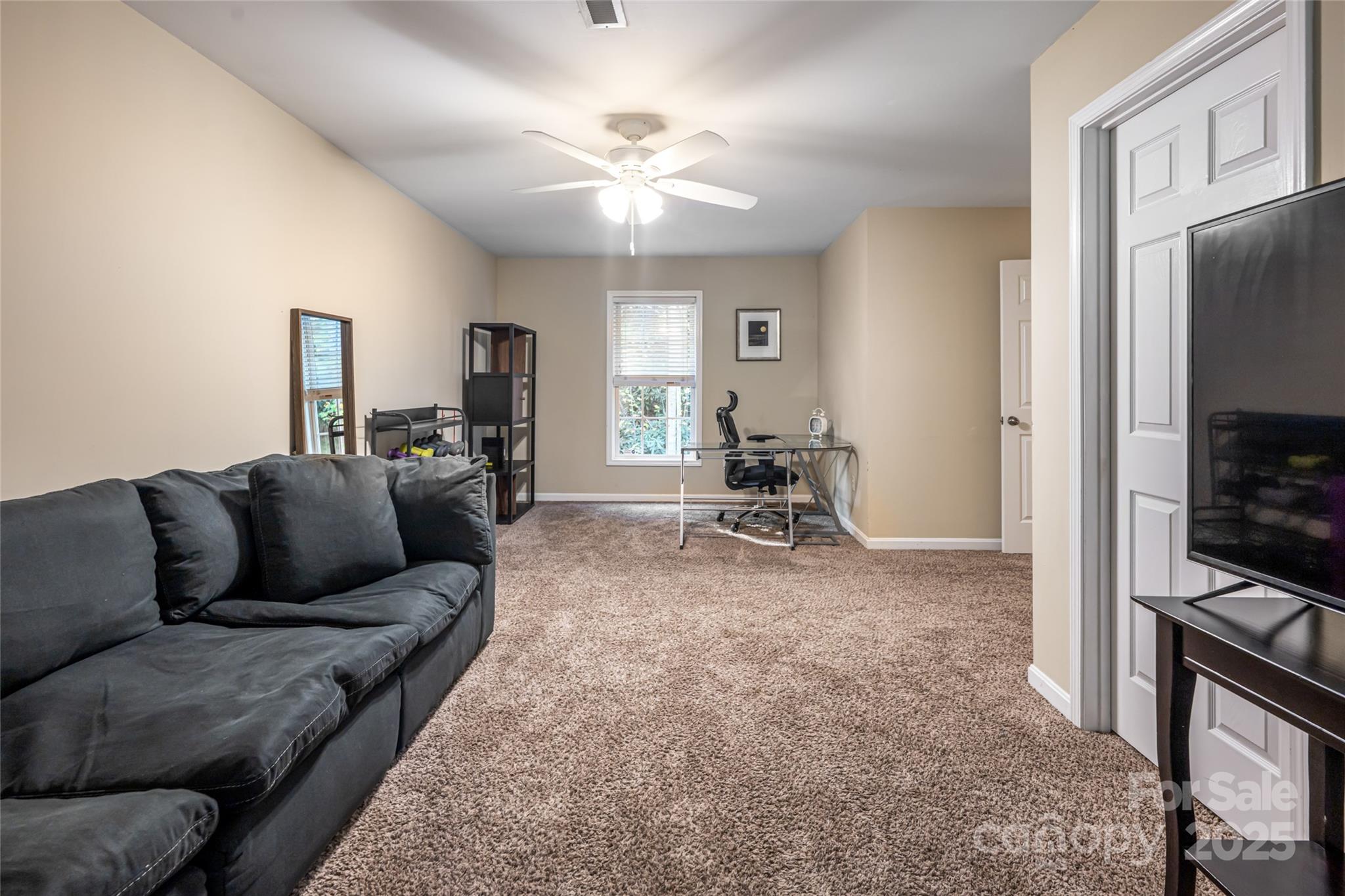 315 Glenn Bridge Road Arden, NC 28704 - Photo 36 of 45 a living room with furniture and a flat screen tv