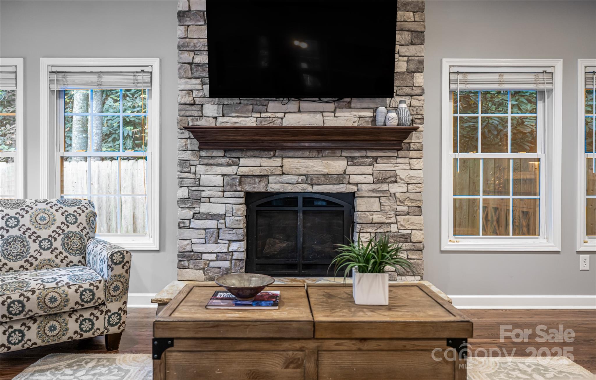 315 Glenn Bridge Road Arden, NC 28704 - Photo 10 of 45 a living room with furniture and a fireplace