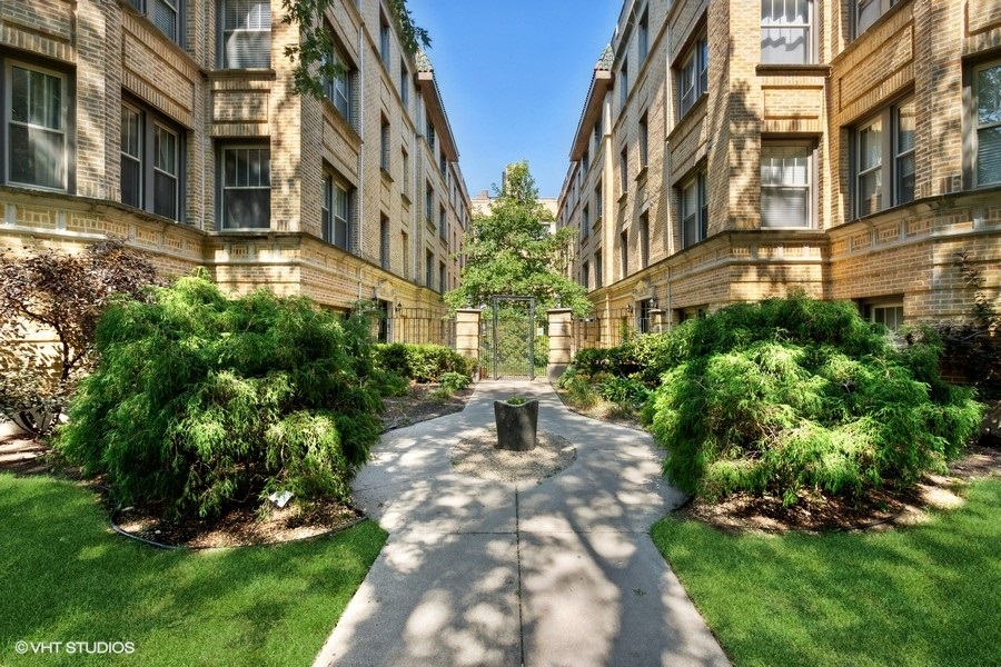 a view of a building with a yard