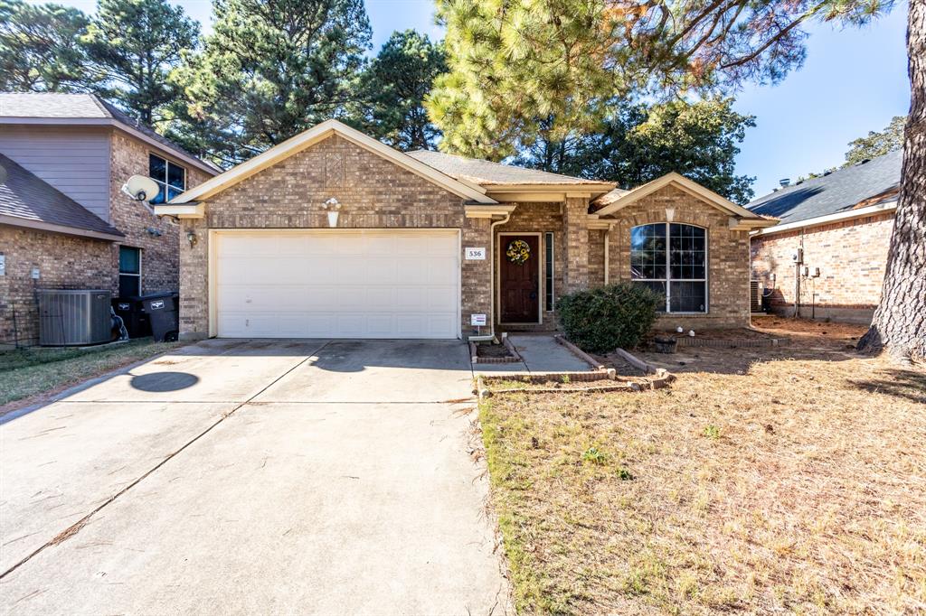 536 Cross Ridge Circle Fort Worth, TX 76120 - Photo 2 of 23 View of front of property with a garage and central AC unit