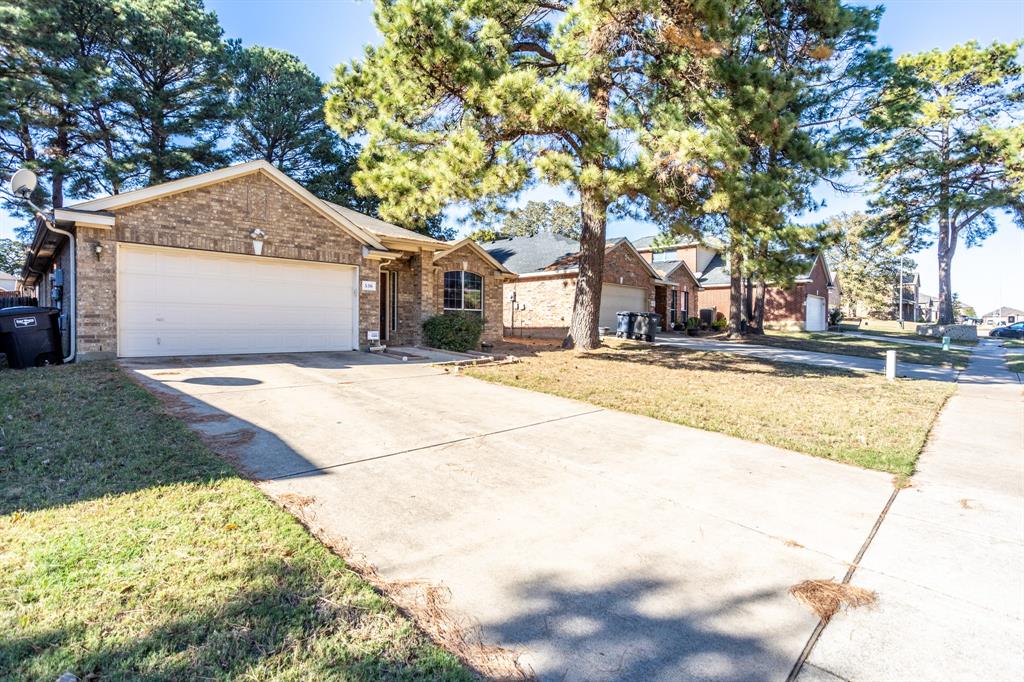 536 Cross Ridge Circle Fort Worth, TX 76120 - Photo 22 of 23 Ranch-style house featuring a garage and a front yard