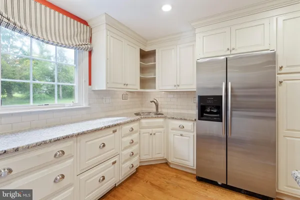 a kitchen with appliances cabinets and a sink