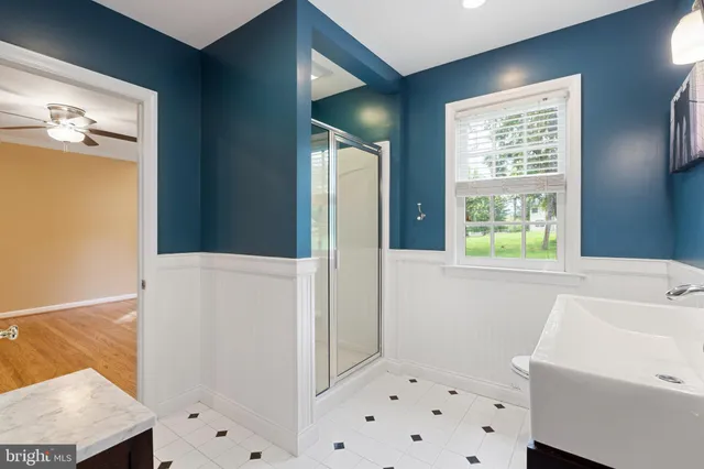 a bathroom with a bathtub and a sink