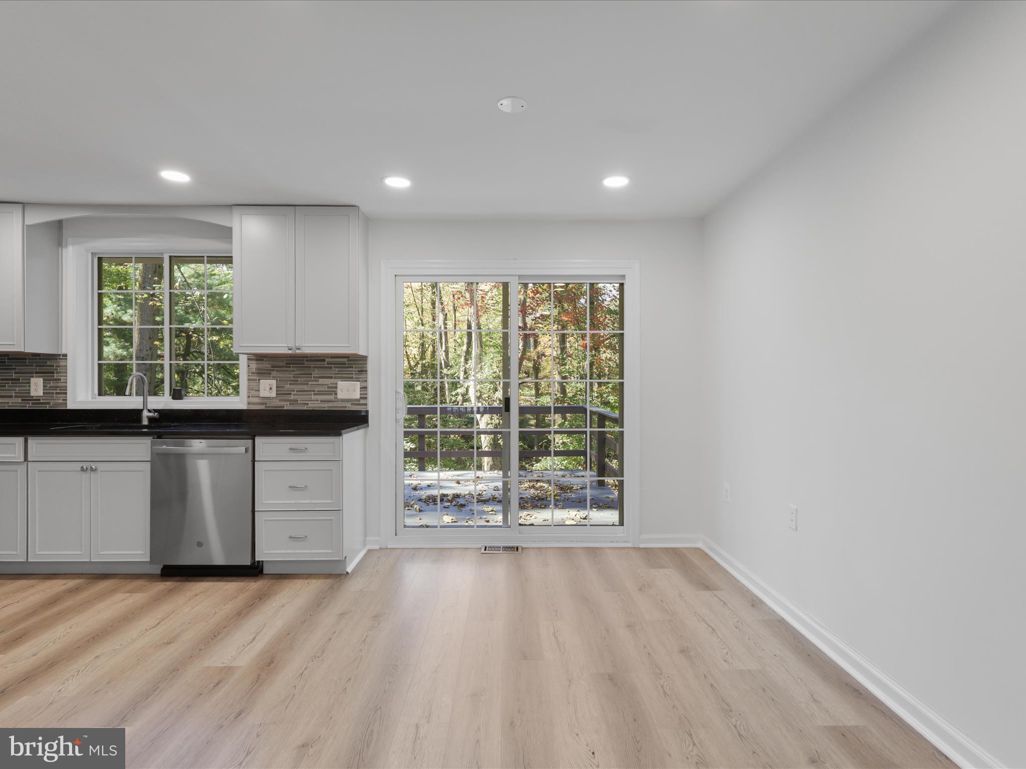 2369 Old Trail Drive Reston, VA 20191 - Photo 14 of 50 a view of a kitchen with a sink and a large window