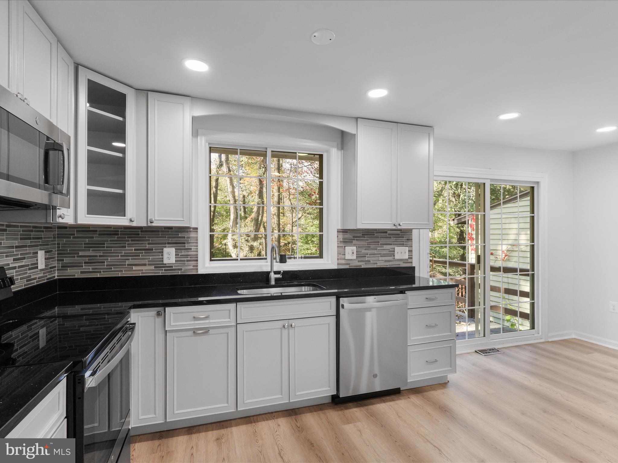 2369 Old Trail Drive Reston, VA 20191 - Photo 18 of 50 a kitchen with lots of counter space and windows