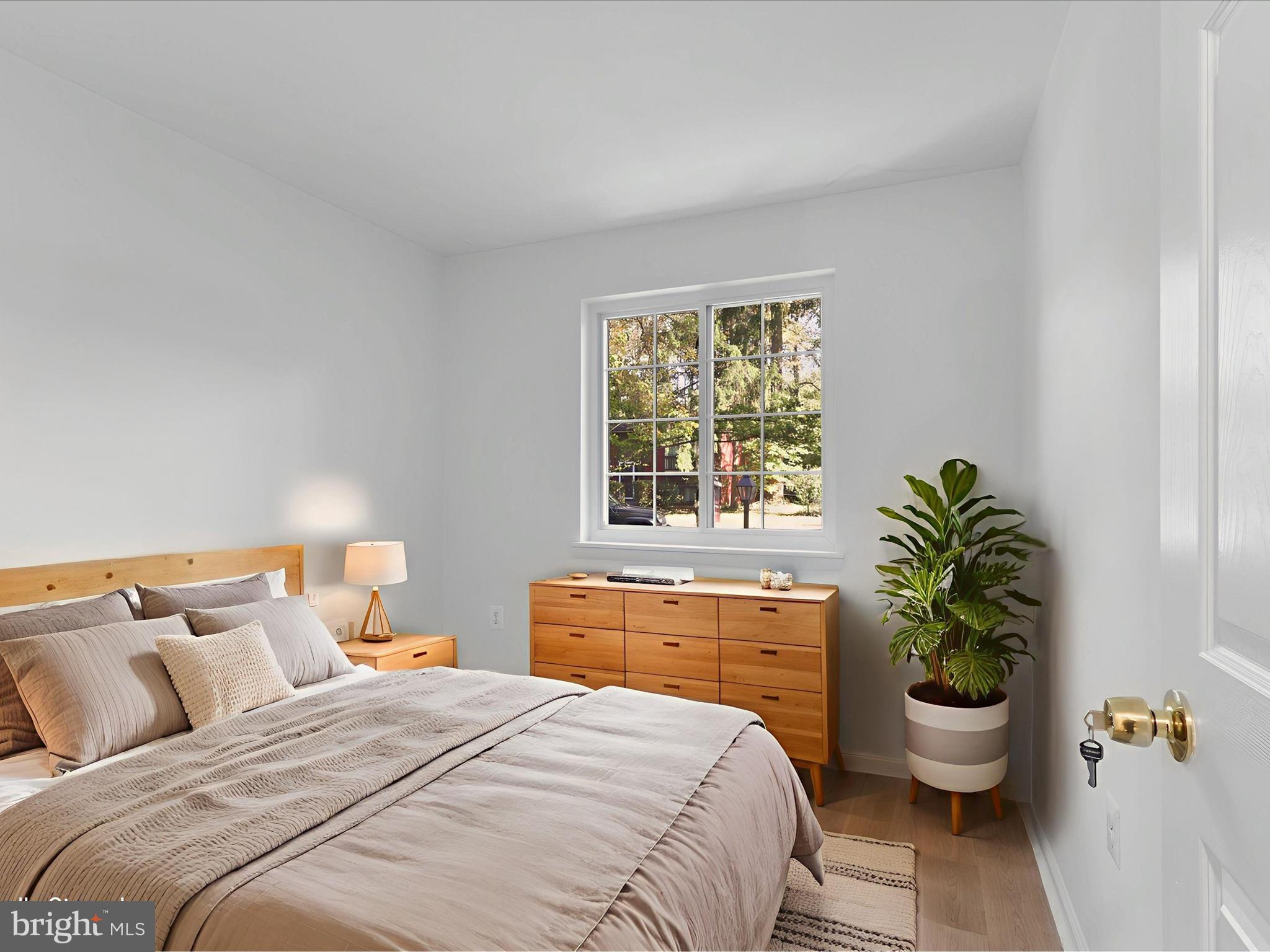 2369 Old Trail Drive Reston, VA 20191 - Photo 21 of 50 a bedroom with a bed and a potted plant