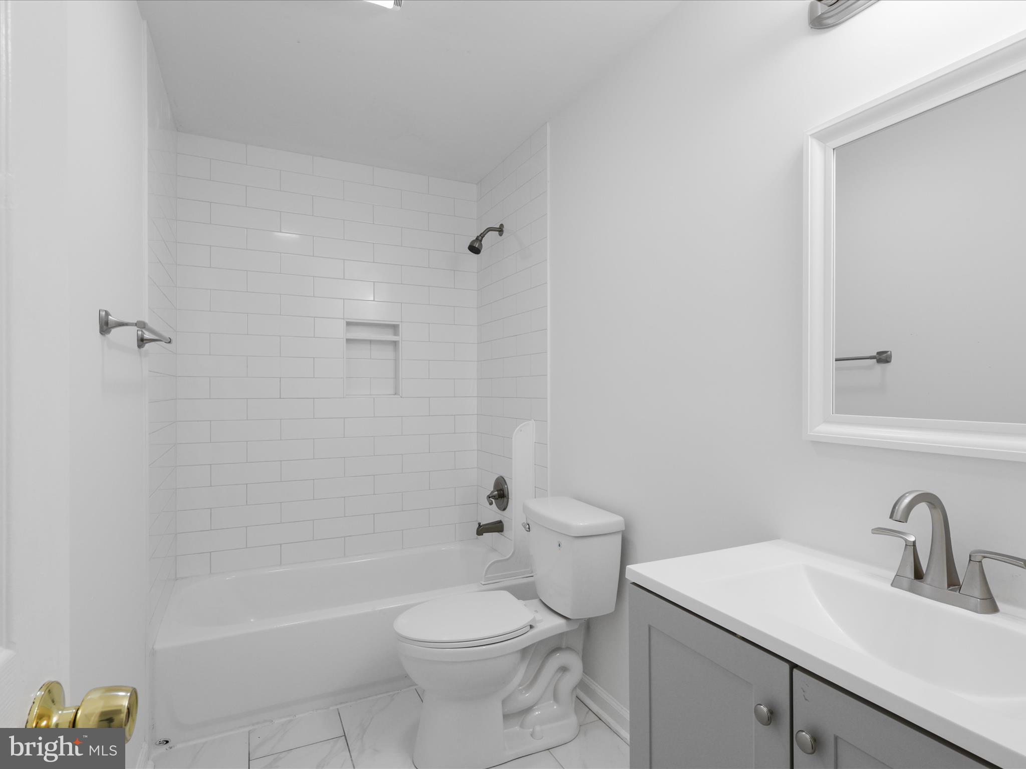 2369 Old Trail Drive Reston, VA 20191 - Photo 25 of 50 a bathroom with a sink a toilet and shower