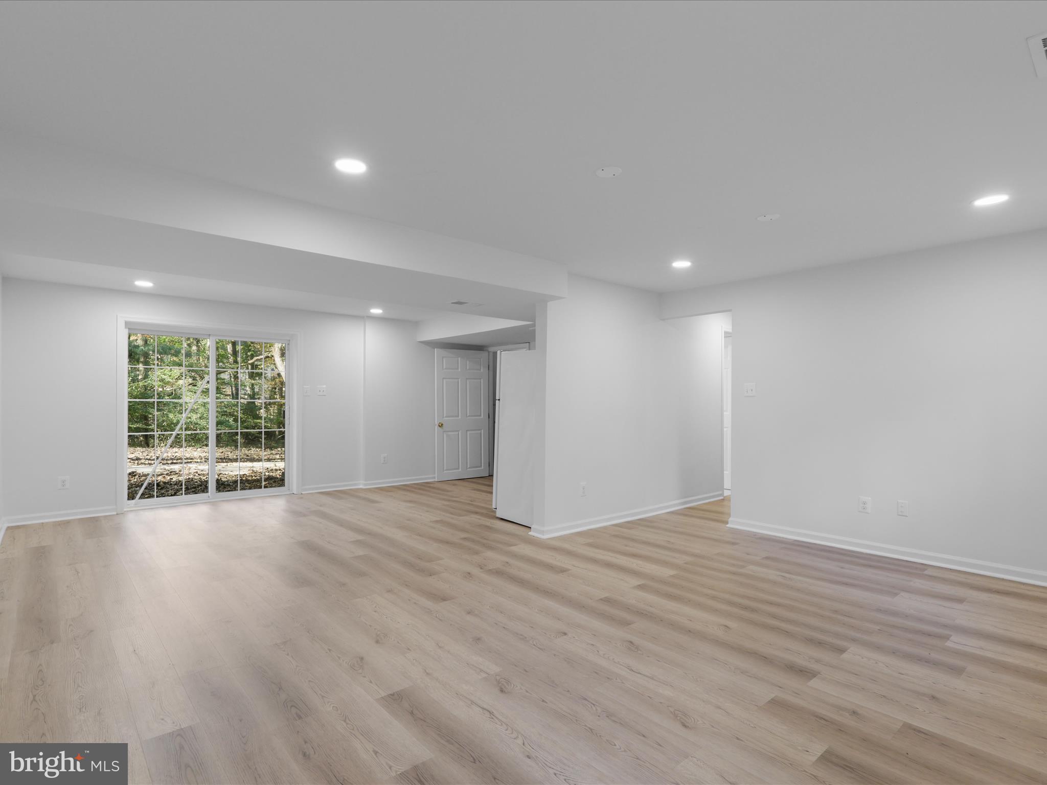 2369 Old Trail Drive Reston, VA 20191 - Photo 29 of 50 a view of an empty room with wooden floor and a window