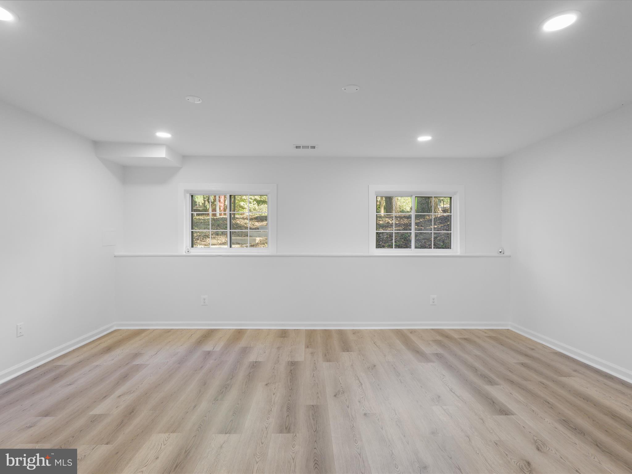 2369 Old Trail Drive Reston, VA 20191 - Photo 30 of 50 a view of a big room with wooden floor and windows