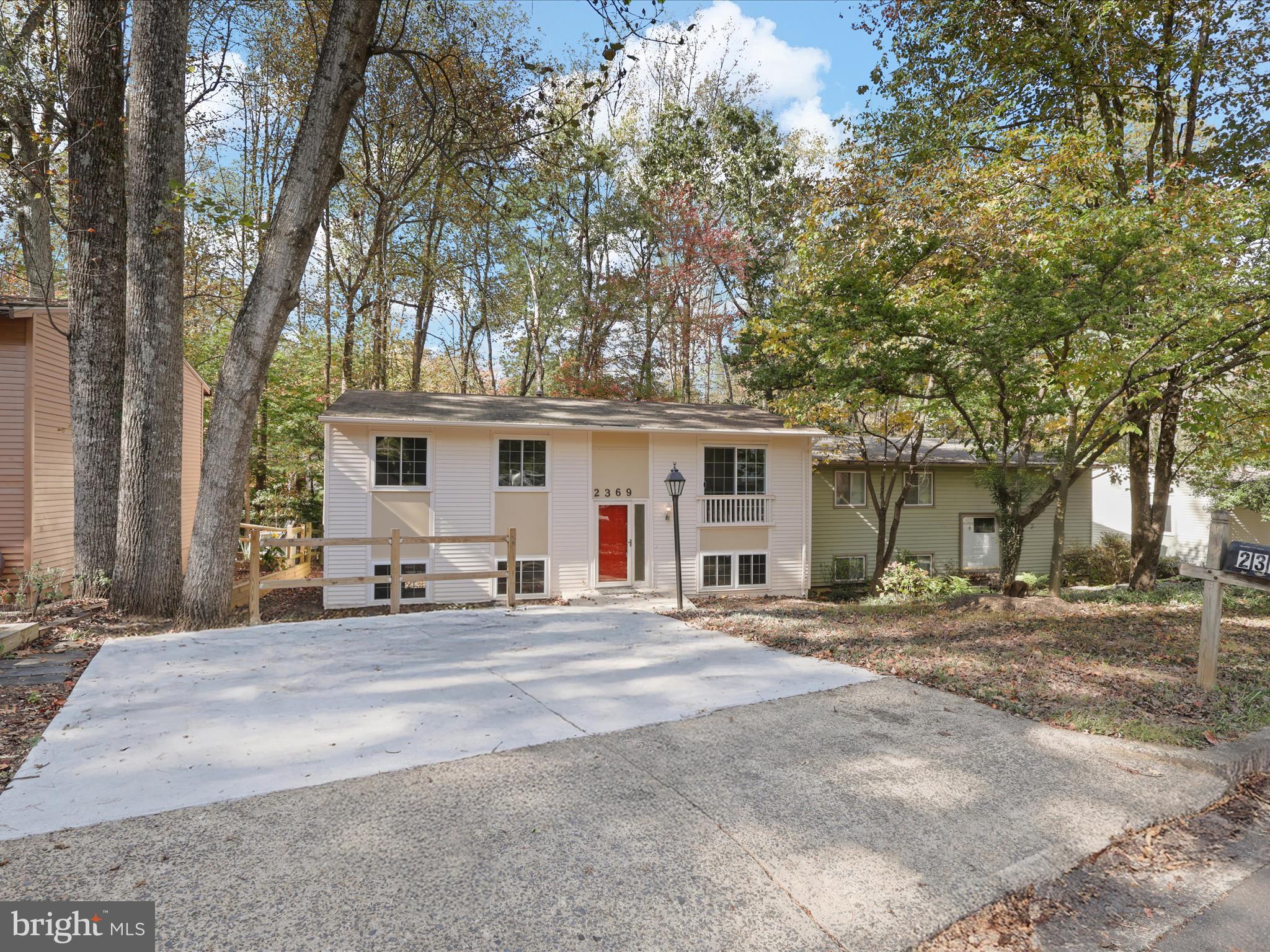 2369 Old Trail Drive Reston, VA 20191 - Photo 3 of 50 a front view of a house with a sitting area